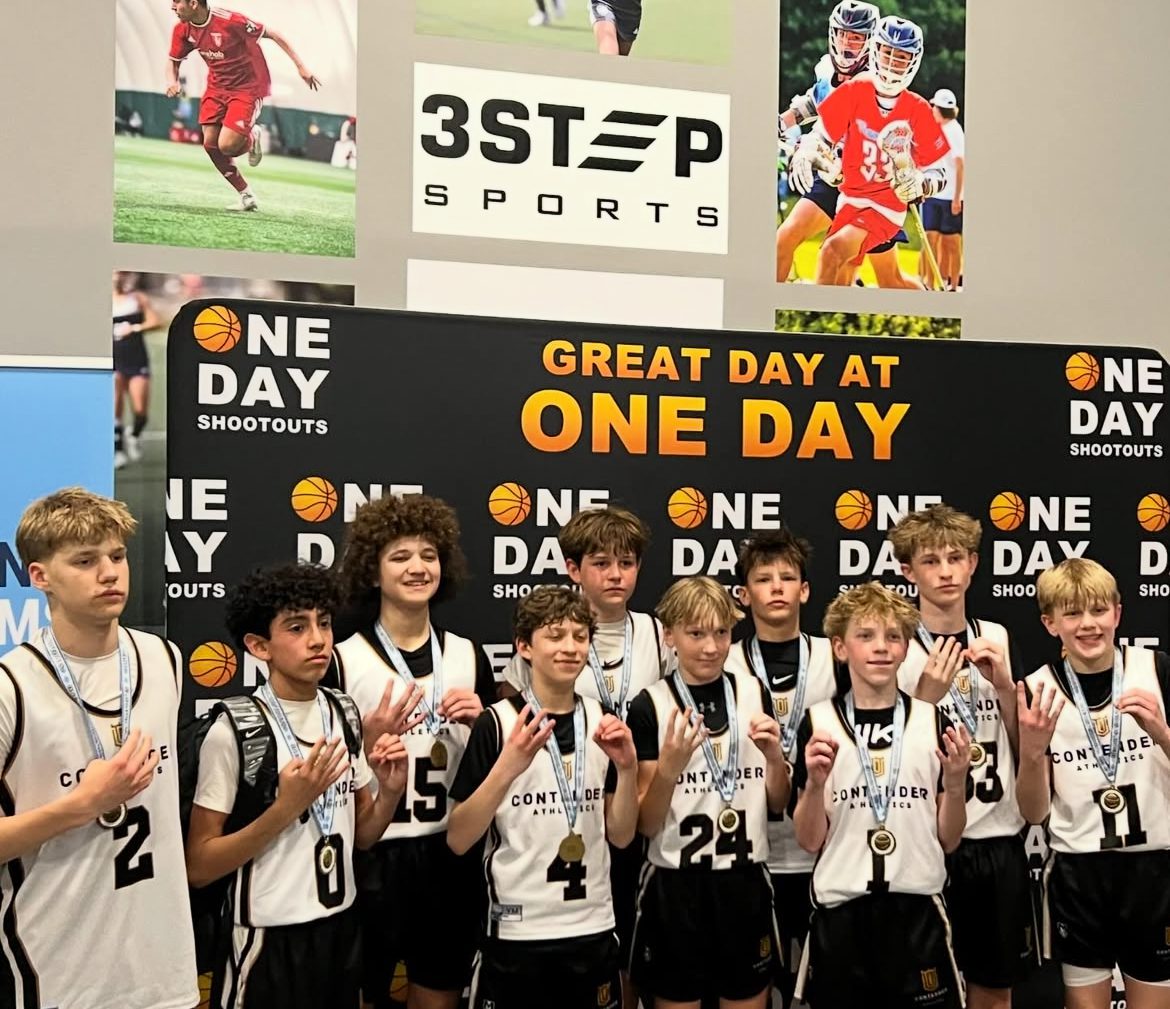 Young basketball team posing with medals and trophies at a sports event.